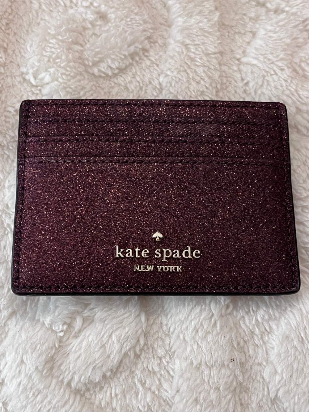 kate spade glitter card holder - plum with gold logo
